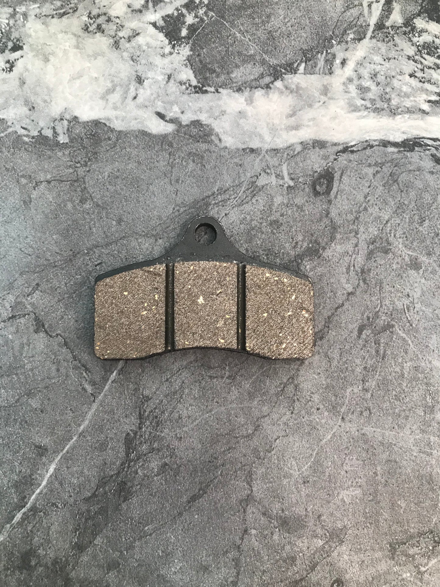 STR-V2 front brake pad black.